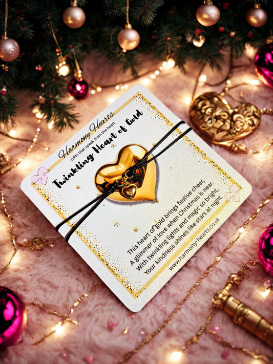 Gold heart charm bracelet on a festive poem card