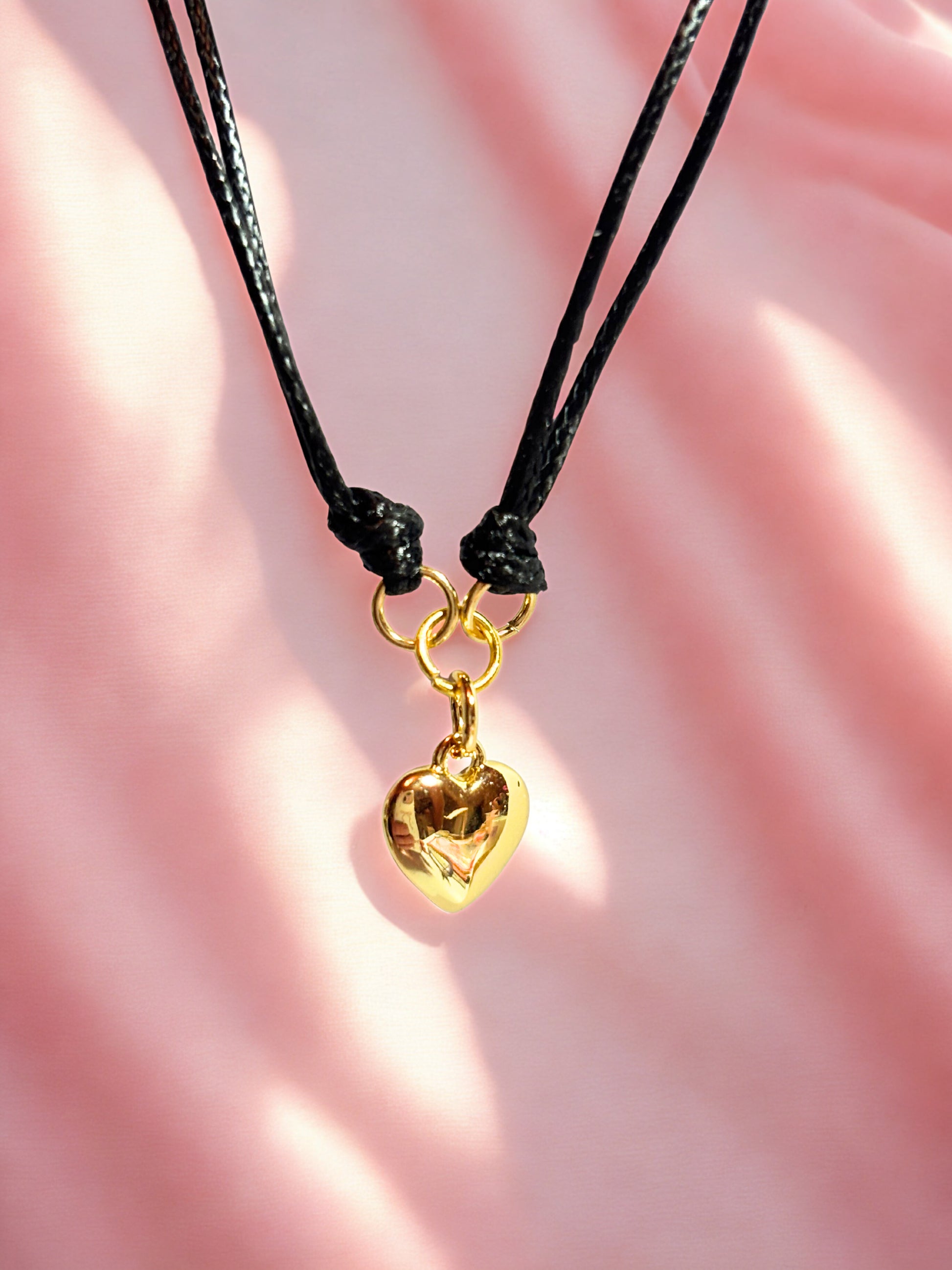Black cord with gold heart charm bracelet