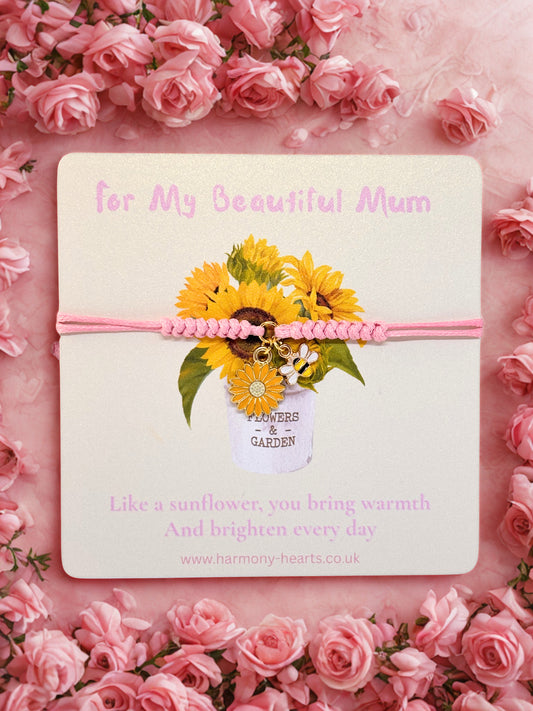 Sunflower and bee charm bracelet on a branded Harmony Hearts card with sunflower design and text 'For My Beautiful Mum' on a pink floral background