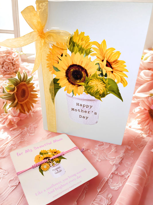 Mother's Day card with sunflowers and a yellow ribbon on a pink floral background with matching charm bracelet nd card