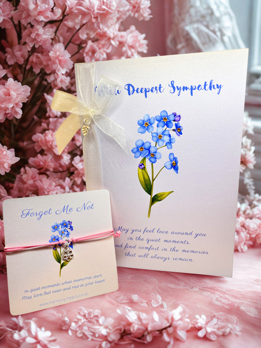 Sympathy card with forget me not illustration and matching bracelet card with pink cord charm bracelet
