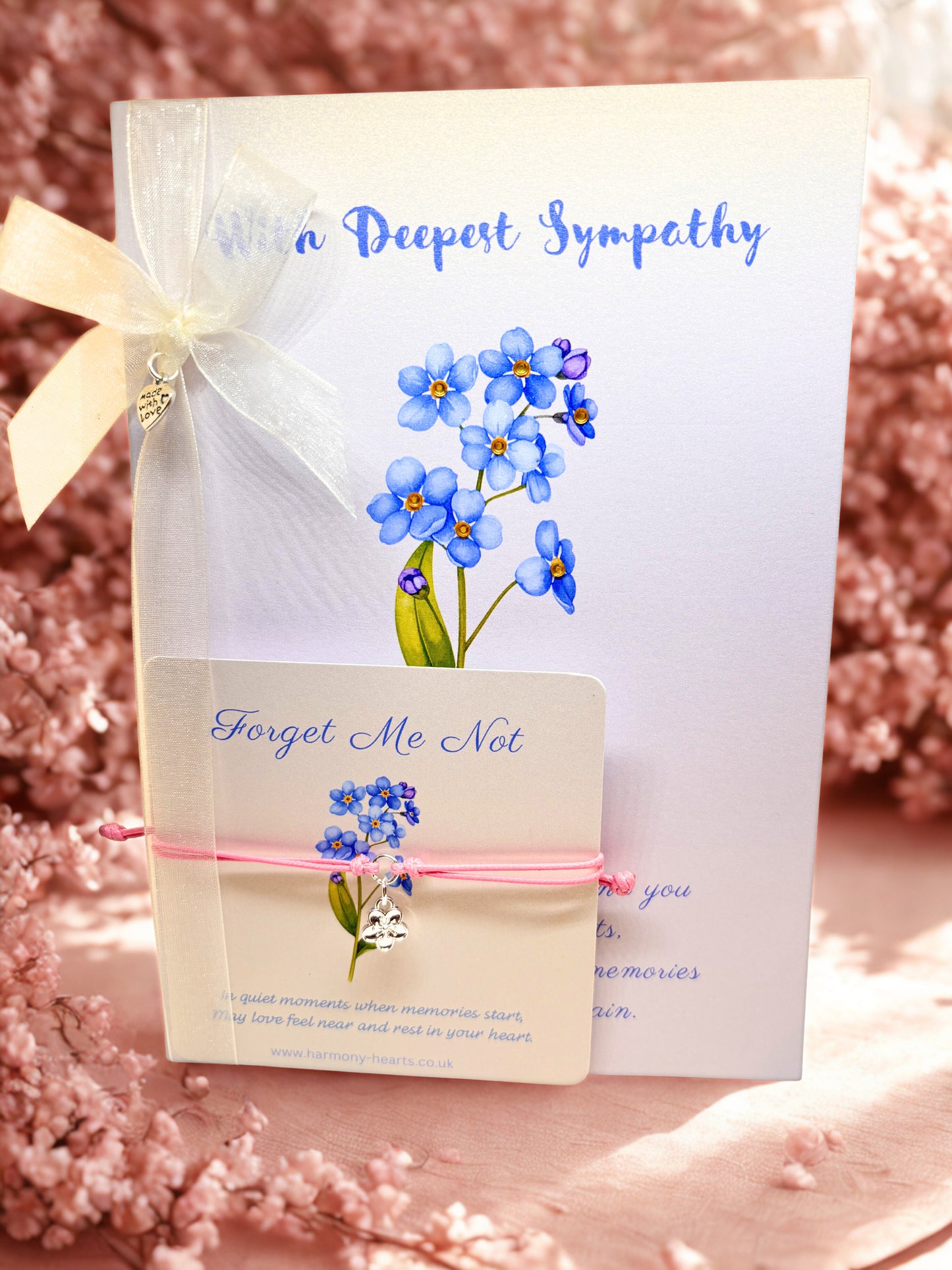 Deepest Sympathy card with forget me not design with ribbon and rhinestone detail and matching bracelet card with pink cord charm bracelet