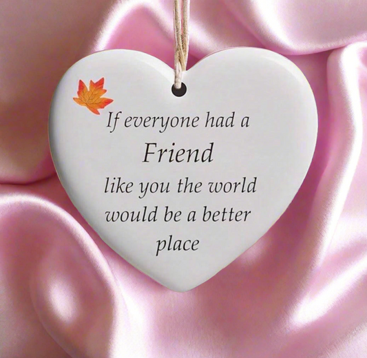 Heart-shaped plaque with a message on a pink satin background