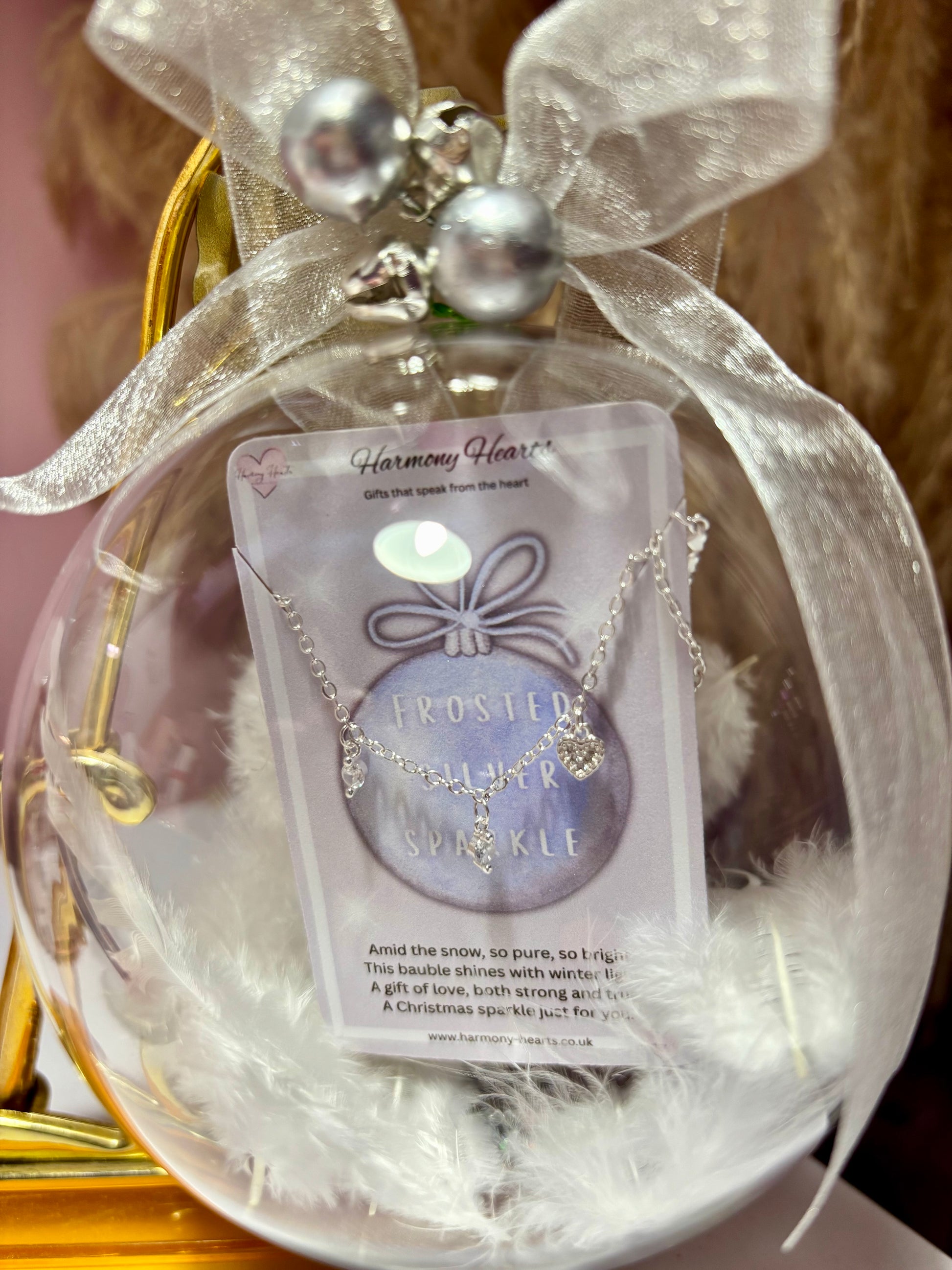 Clear Chrisrmas bauble with a bracelet inside