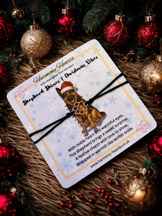 German shepherd card with paw print bracelet under a Christmas tree
