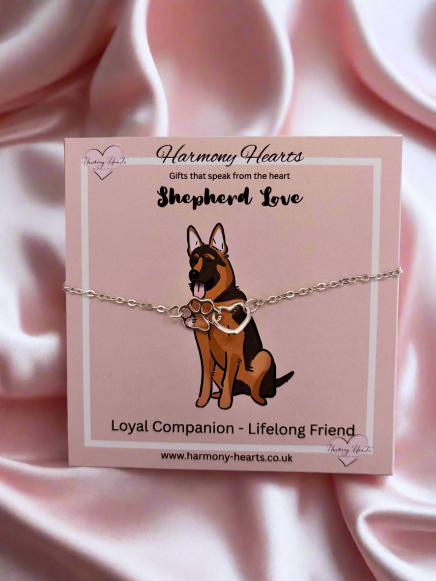 Dog-themed bracelet on a pink card with 'Harmony Hearts' branding