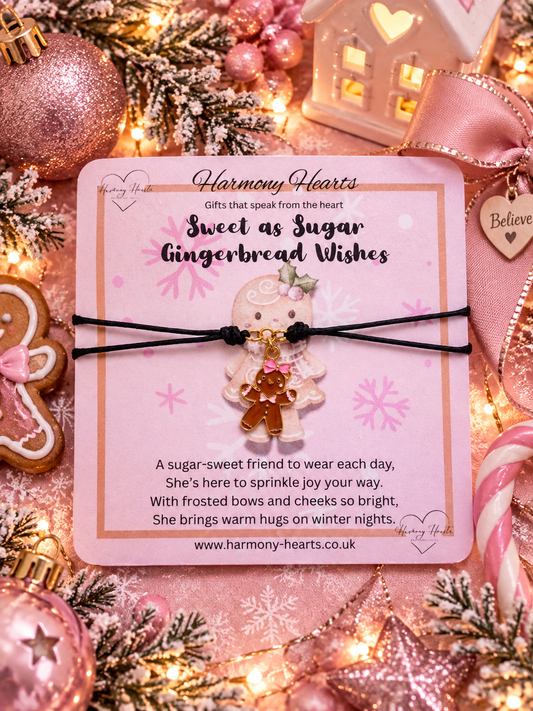 A Christmas-themed bracelet from Harmony Hearts, featuring a gingerbread charm, presented on a pink backing card surrounded by festive decorations.