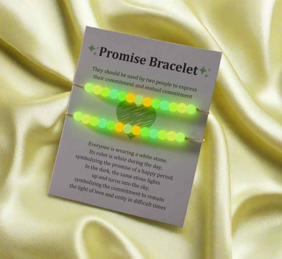 Promise bracelet packaging with green lights on a yellow fabric background