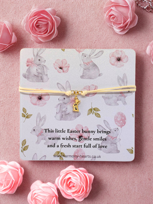 Bunny charm bracelet with an Easter bunny design on a pink background with flowers