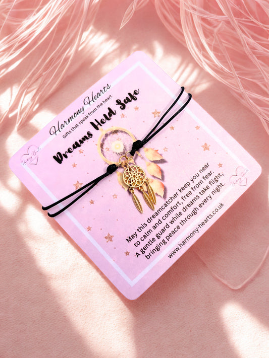 Dreamcatcher bracelet on a pink card with text on a soft pink background
