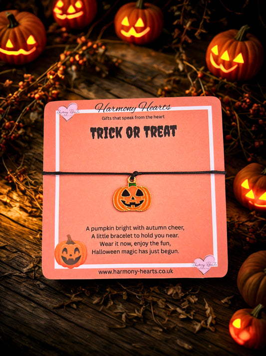 Halloween-themed bracelet packaging with pumpkins and 'Trick or Treat' text on a dark background.