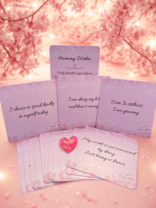 Set of affirmation cards with motivational phrases on a soft pink background with cherry blossoms.