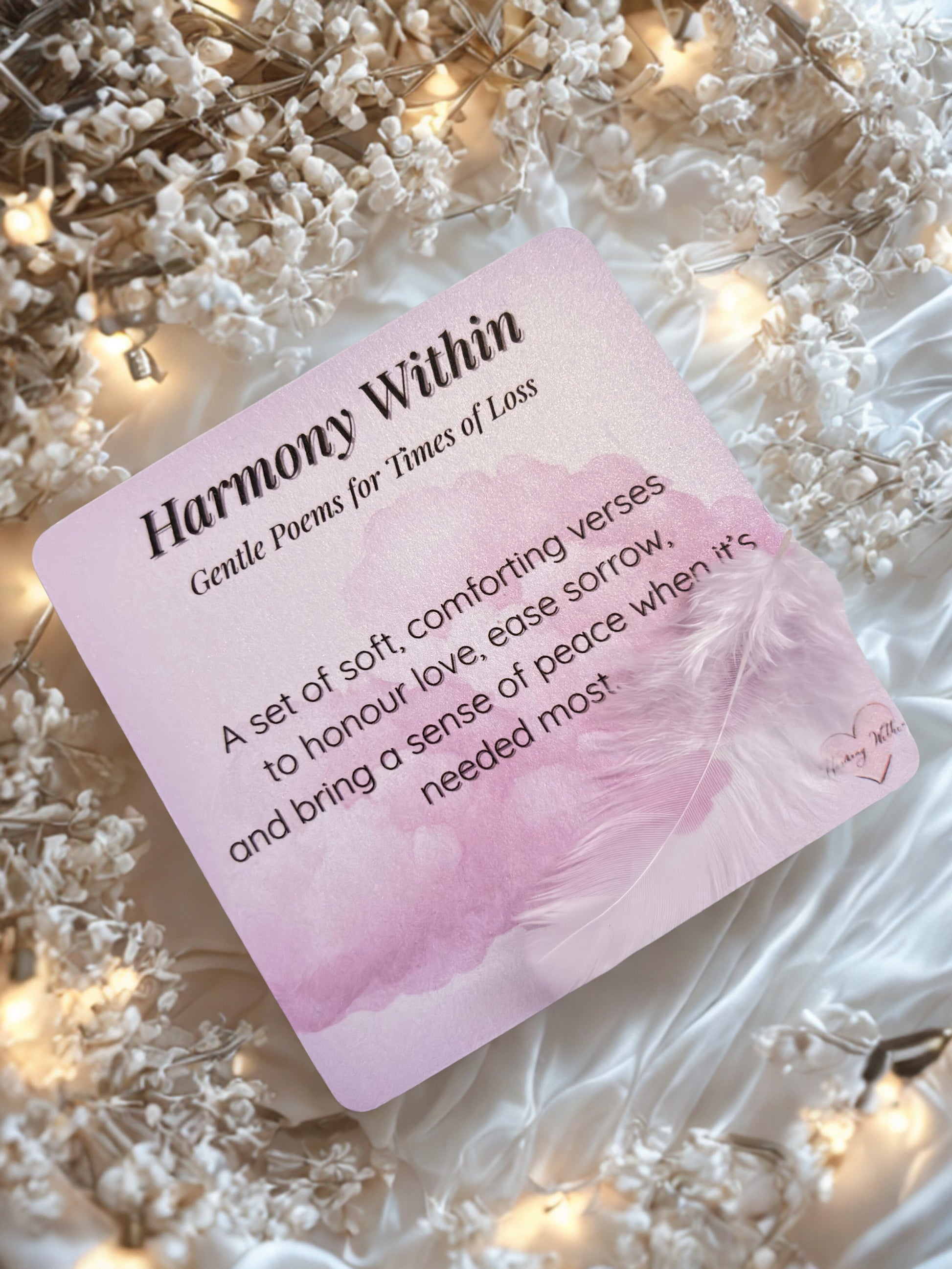 Card titled 'Harmony Within' on a decorative background with lights and flowers