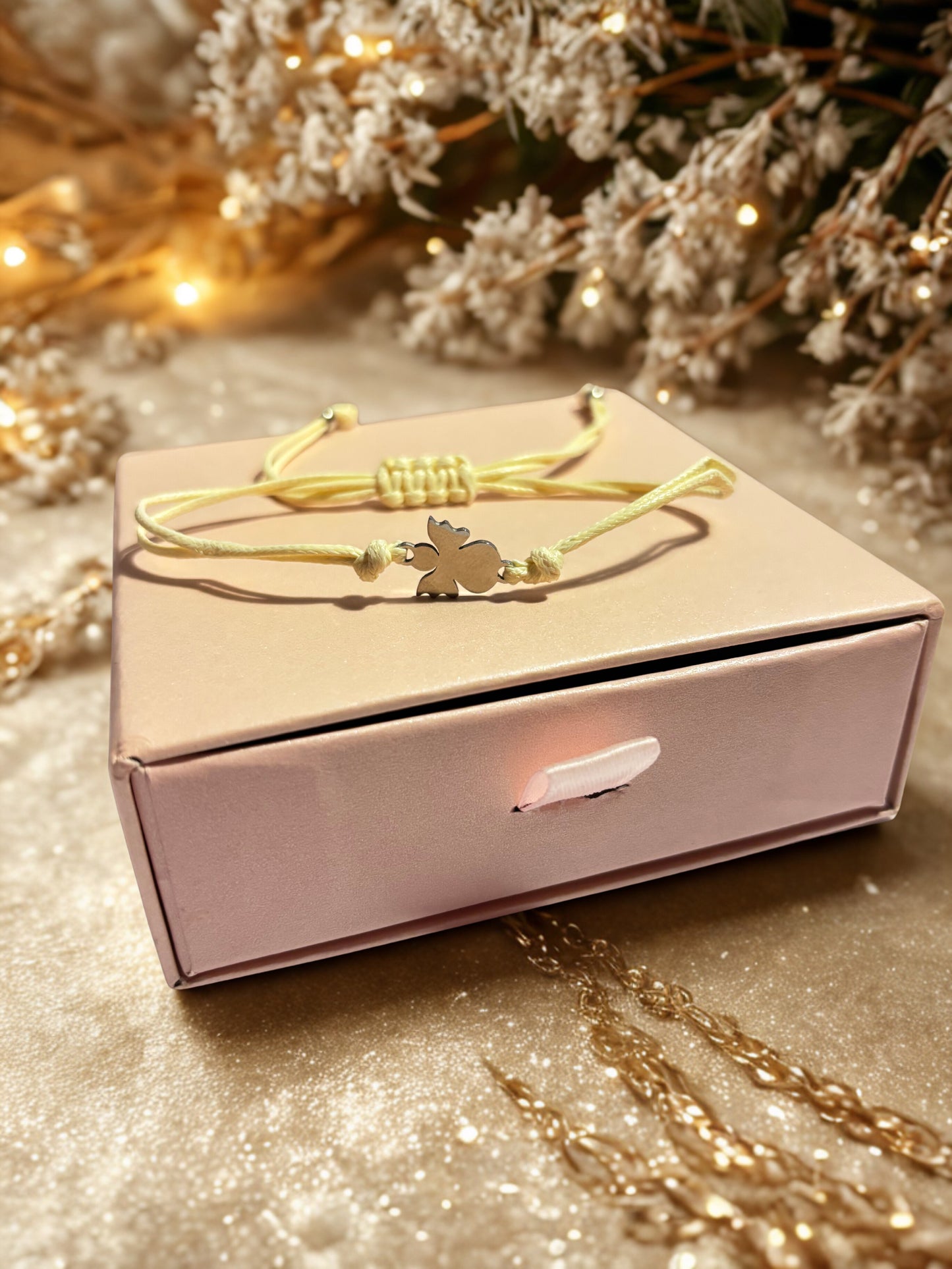 bracelet on a pink box with decorative elements