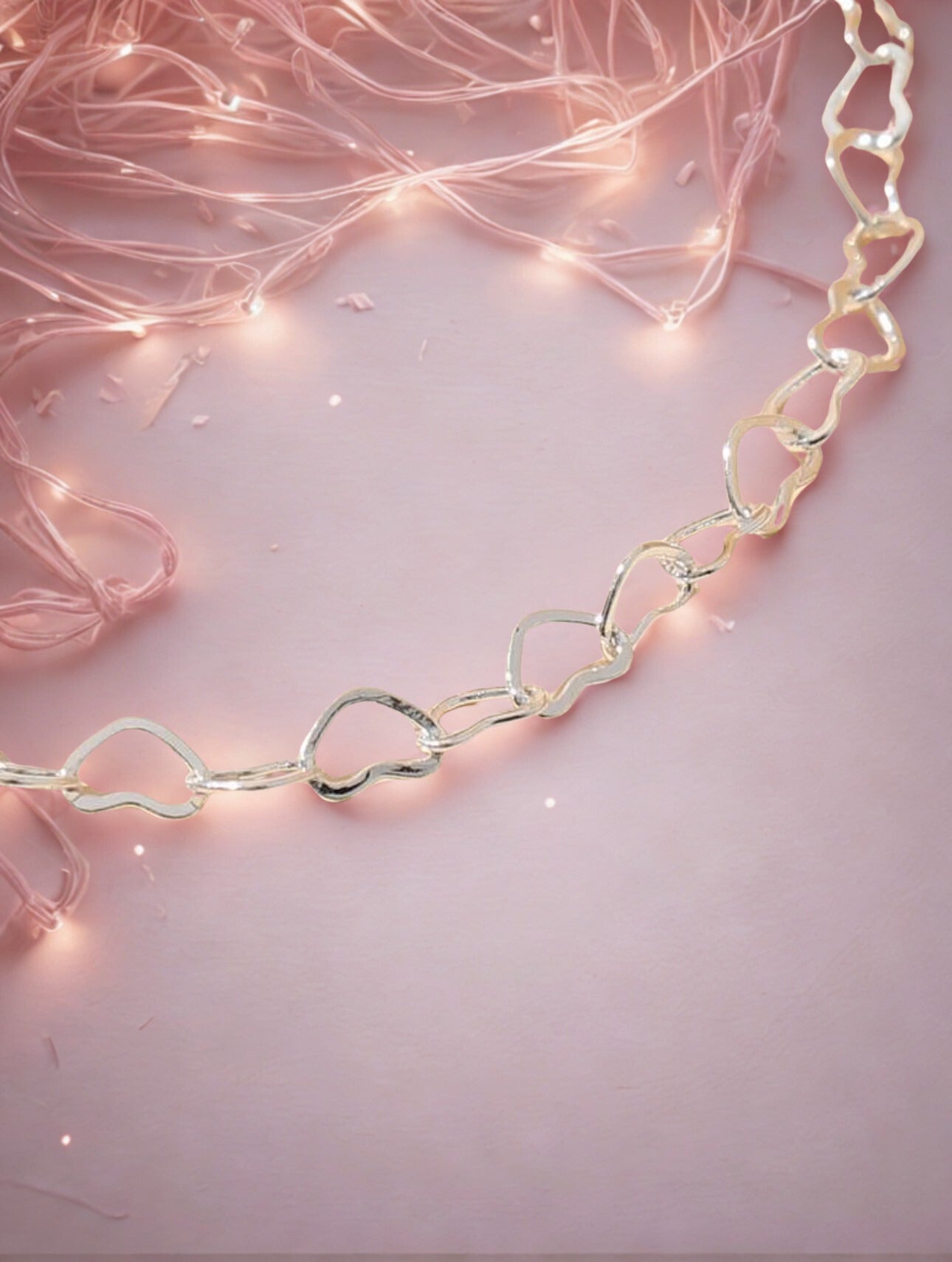  heart bracelet on a pink background