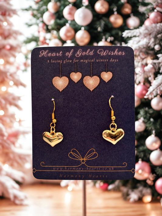 Gold heart drop earrings on a festive Harmony Hearts branded card with Christmas background
