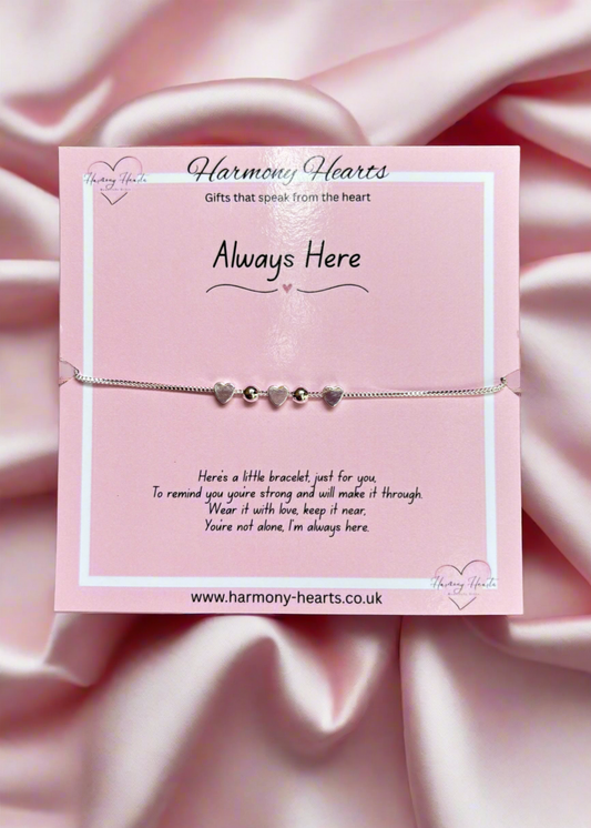 Bracelet on a pink card with 'Harmony Hearts' branding and message.