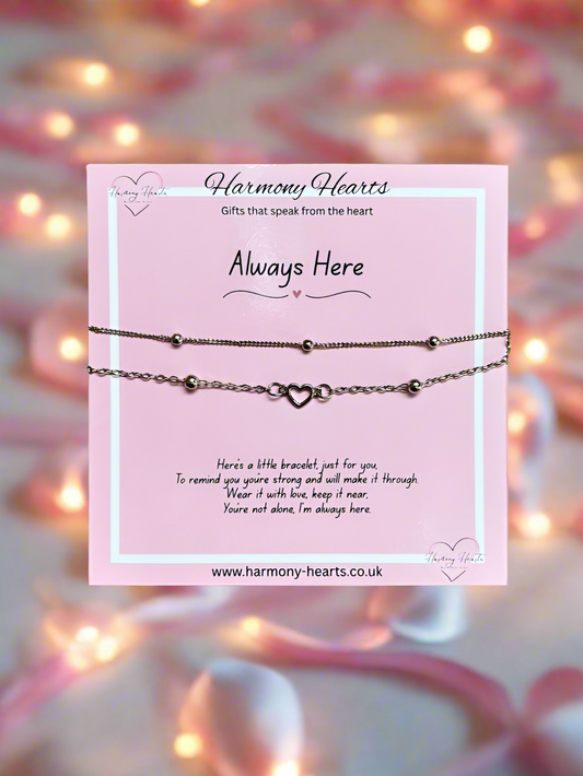 Bracelet on a card with 'Harmony Hearts' branding and a blurred background
