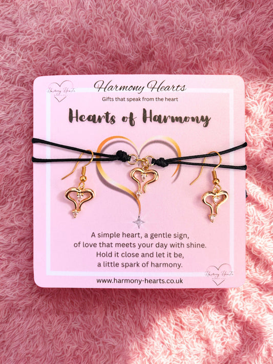 Heart-shaped jewelry set bracelet and earrings on a pink card with 'Harmony Hearts' branding.