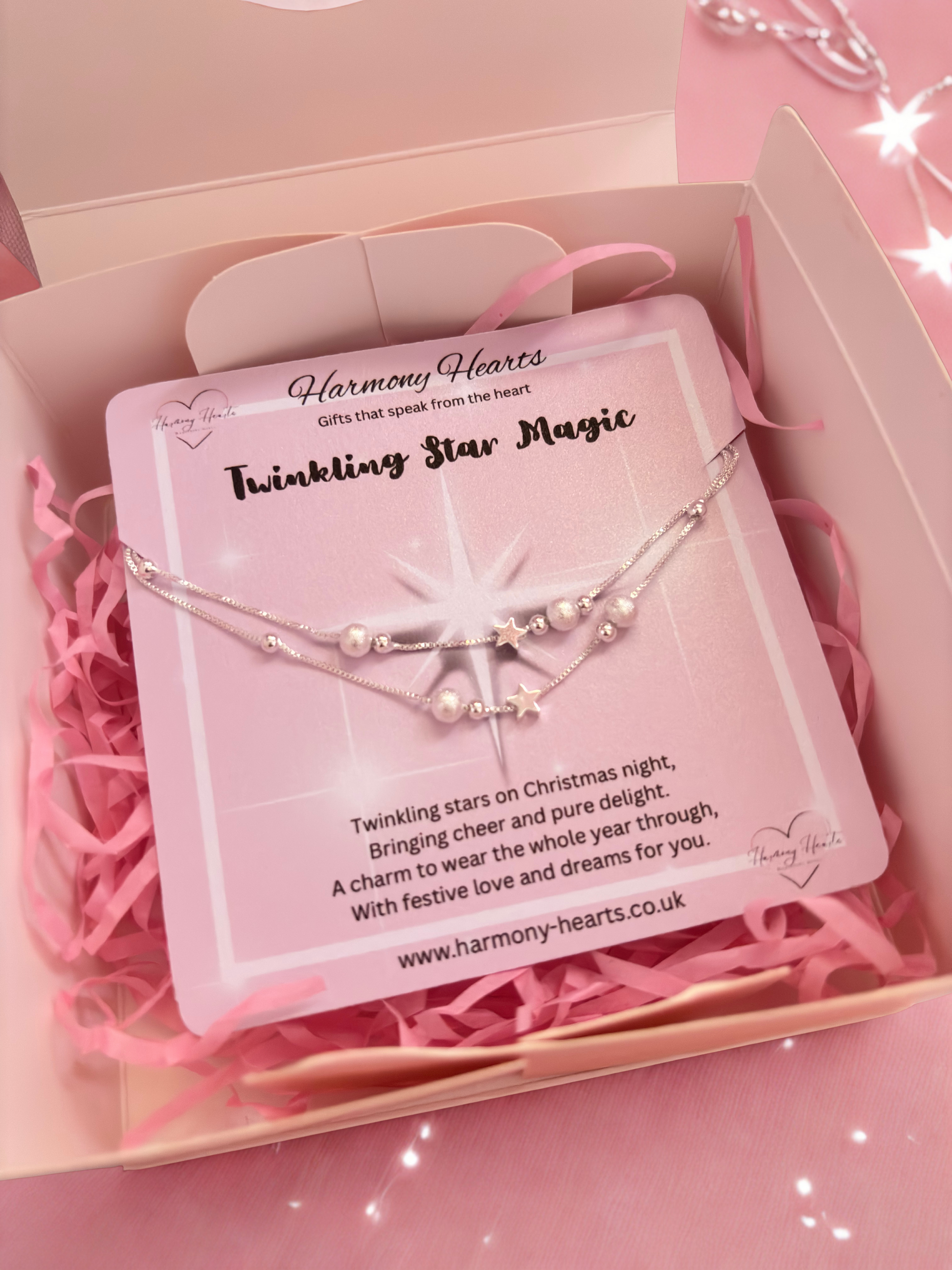 Silver-tone bracelet on Harmony Hearts card in a pink box