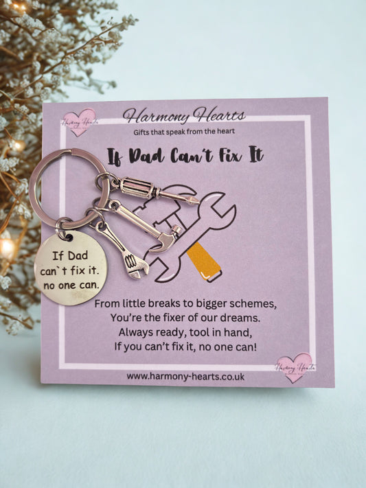 Keychain with tools on a card from Harmony Hearts, featuring text and a website URL.