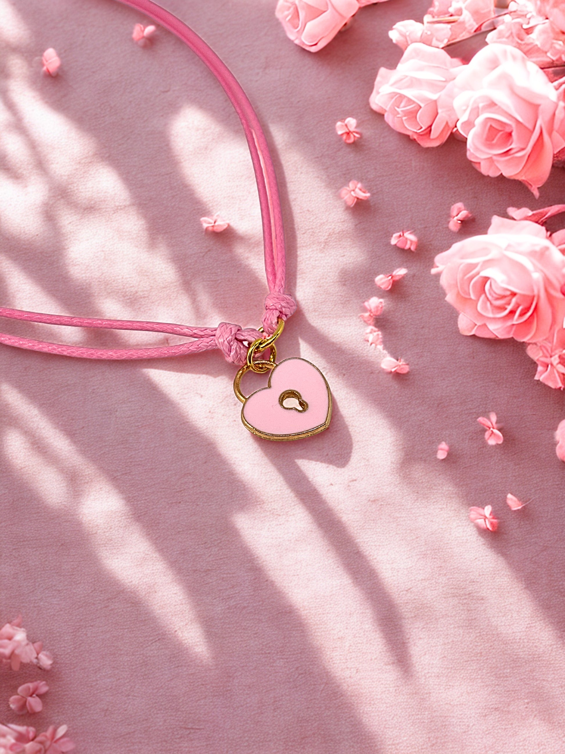 Pink padlock charm bracelet on a soft pink cord