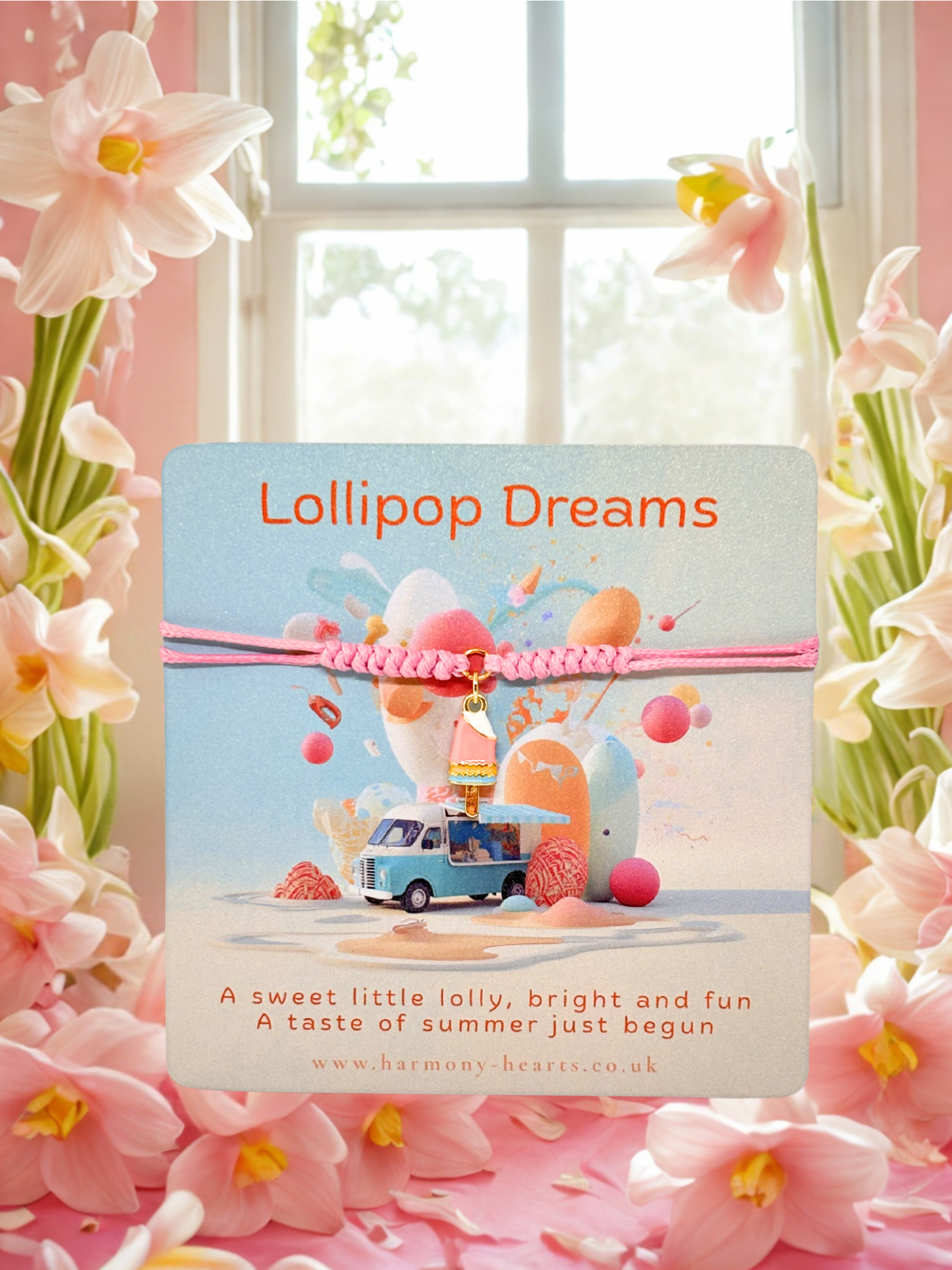 Harmony Hearts card 'Lollipop Dreams' with a colourful design and text, and a pink cord bracelet with a lolly charm surrounded by pink flowers.