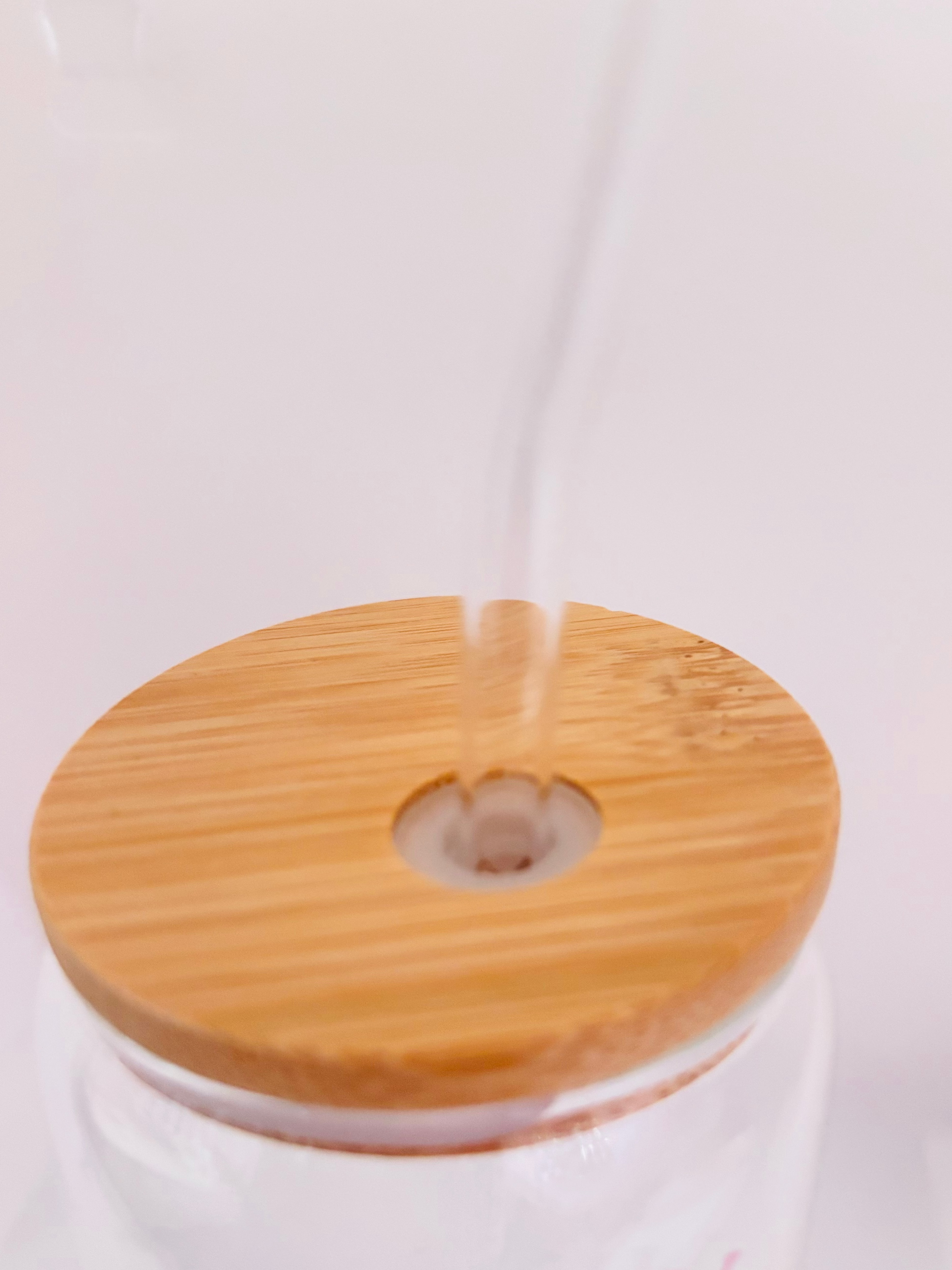 Wooden lid for a cup on a white background