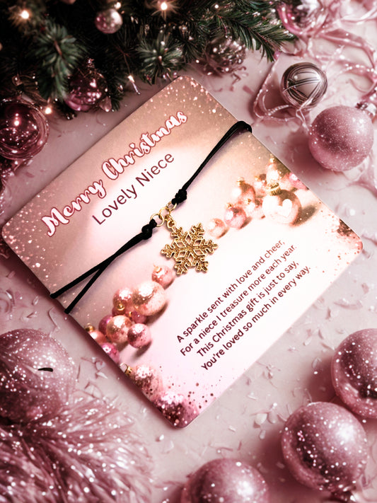 Christmas card with gold snowflake bracelet and festive decorations