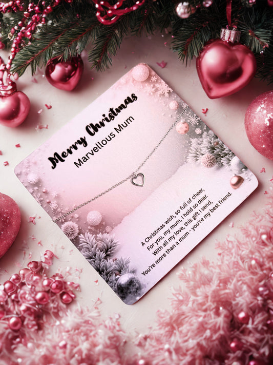 Silver heart bracelet on a Christmas card with 'Merry Christmas Marvellous Mum' text, surrounded by festive decorations.