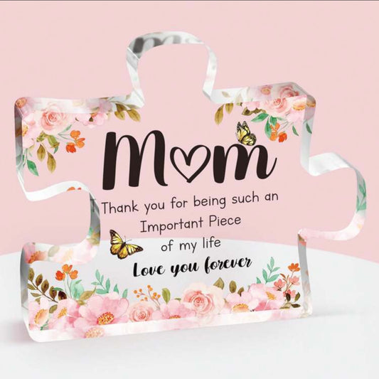 Floral decorative sign with 'Mom' text on a pink background