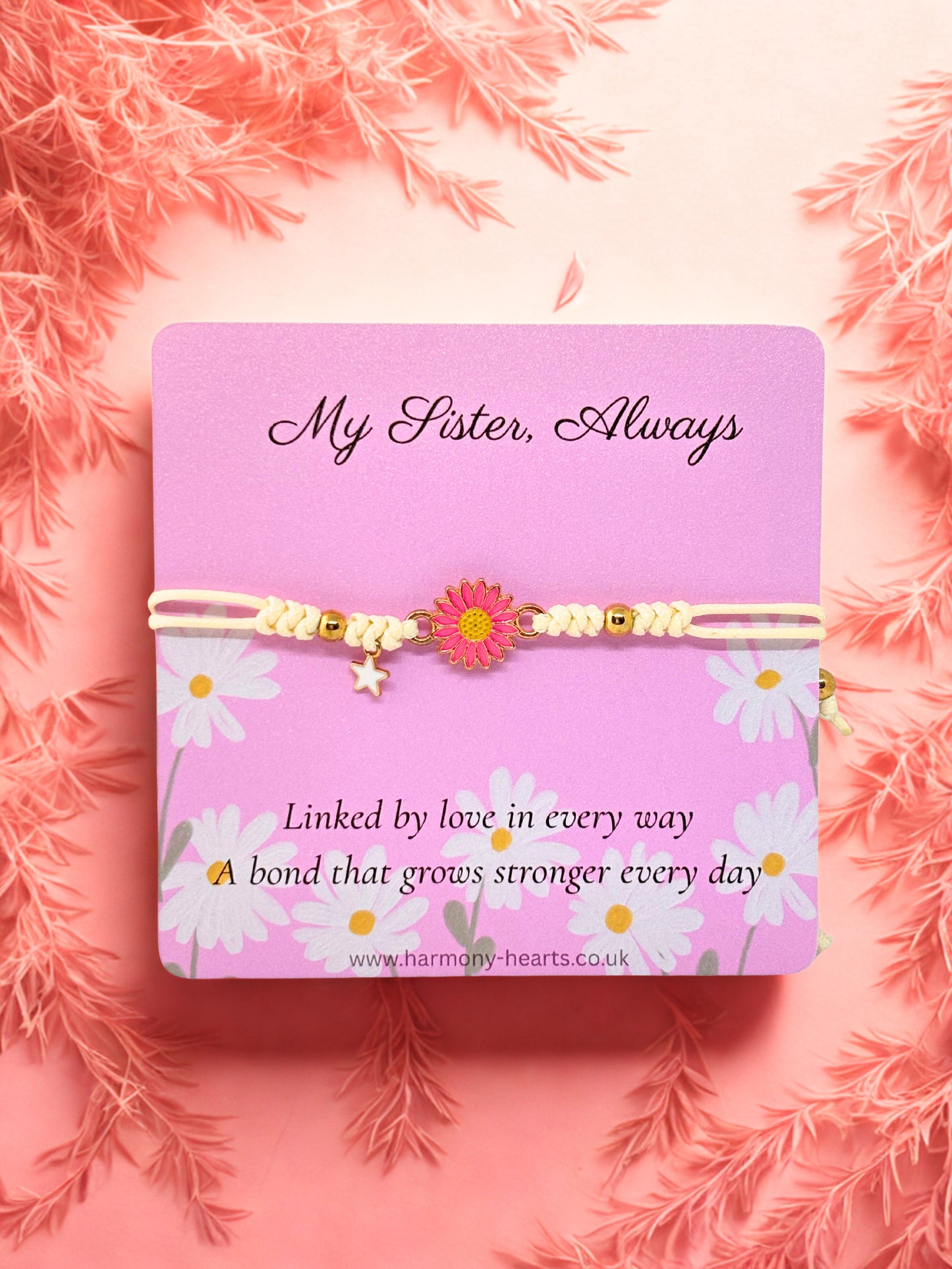 Daisy Bracelet on a pink Harmony Hearts card with floral design and text on a pink background