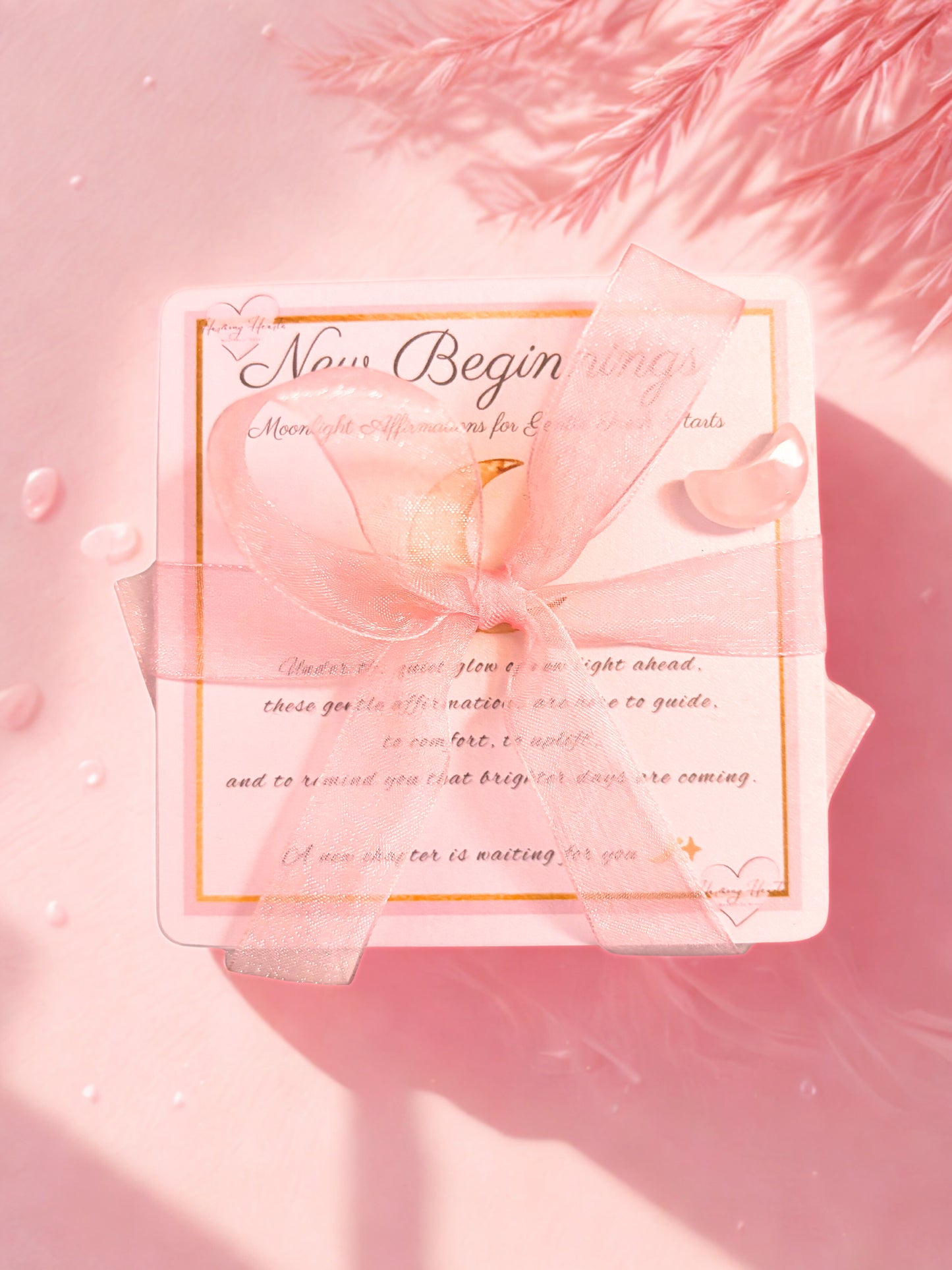 Pink cards reading 'New Beginnings' on a soft pink background