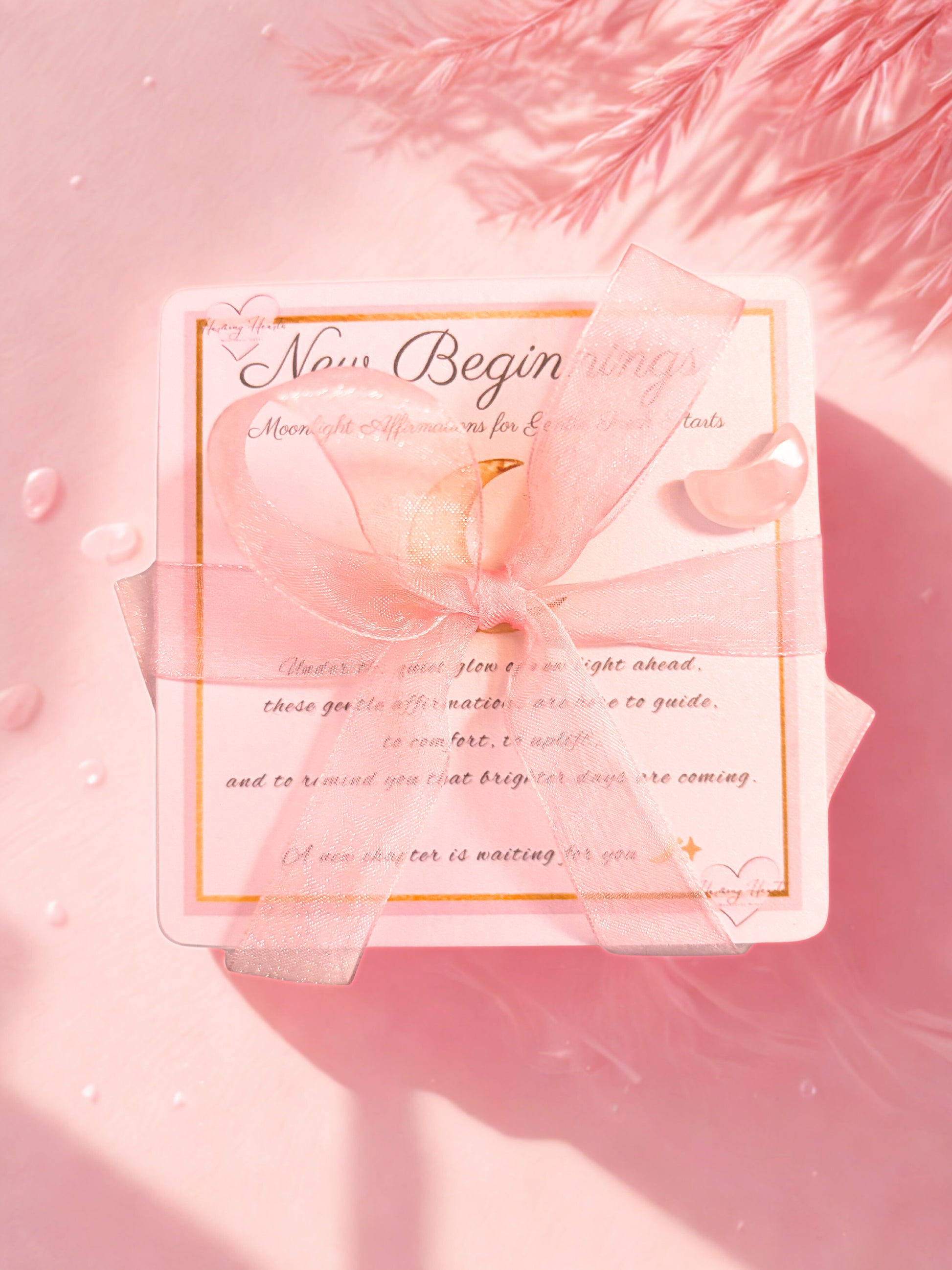 Pink cards reading 'New Beginnings' on a soft pink background