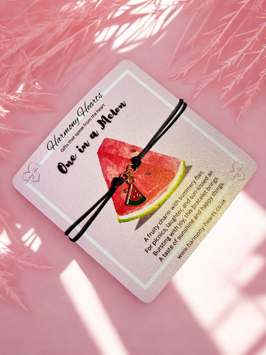 Cord bracelet with a watermelon charm on a pink poem card