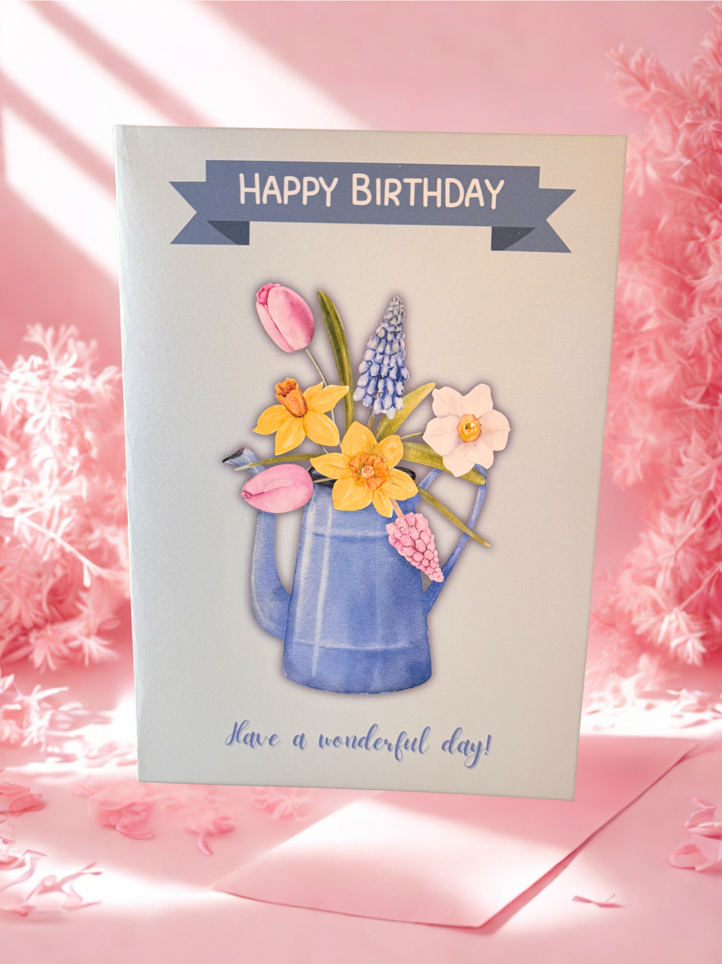 Birthday card with flowers and 'Happy Birthday' text on a pink background