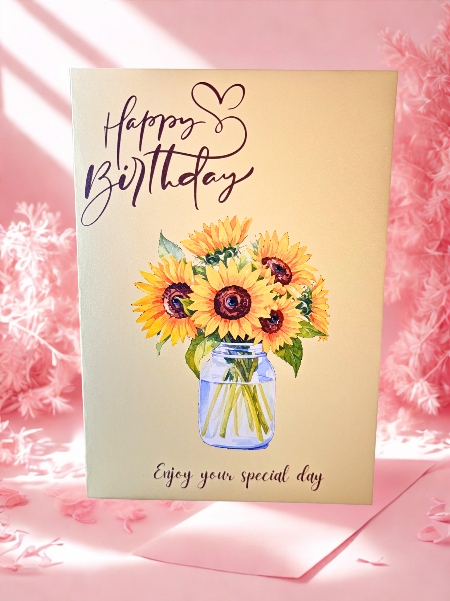 Birthday card with sunflowers in a jar on a pink background