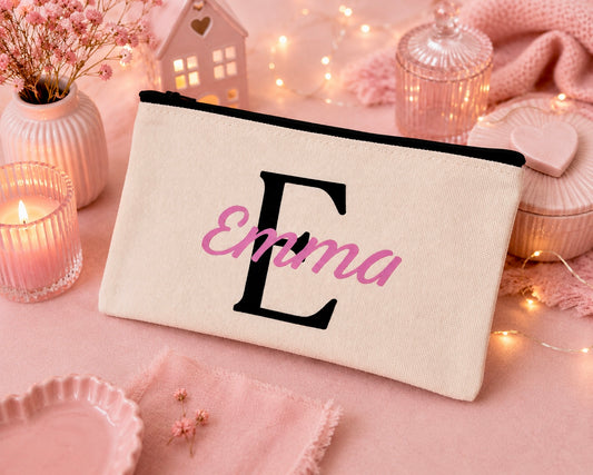 Canvas pencil case with personalised name and initial. Text with a black E and Emma in pink
