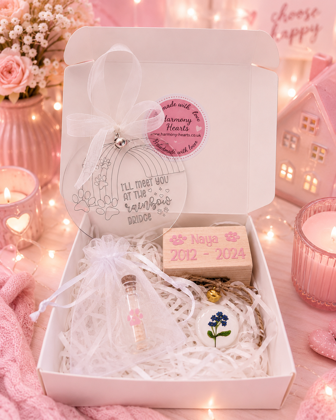 A pink-themed keepsake gift box for a passed bride, containing a small wish jarl, a wooden name keepsake box, a forget-me-not pocket hug