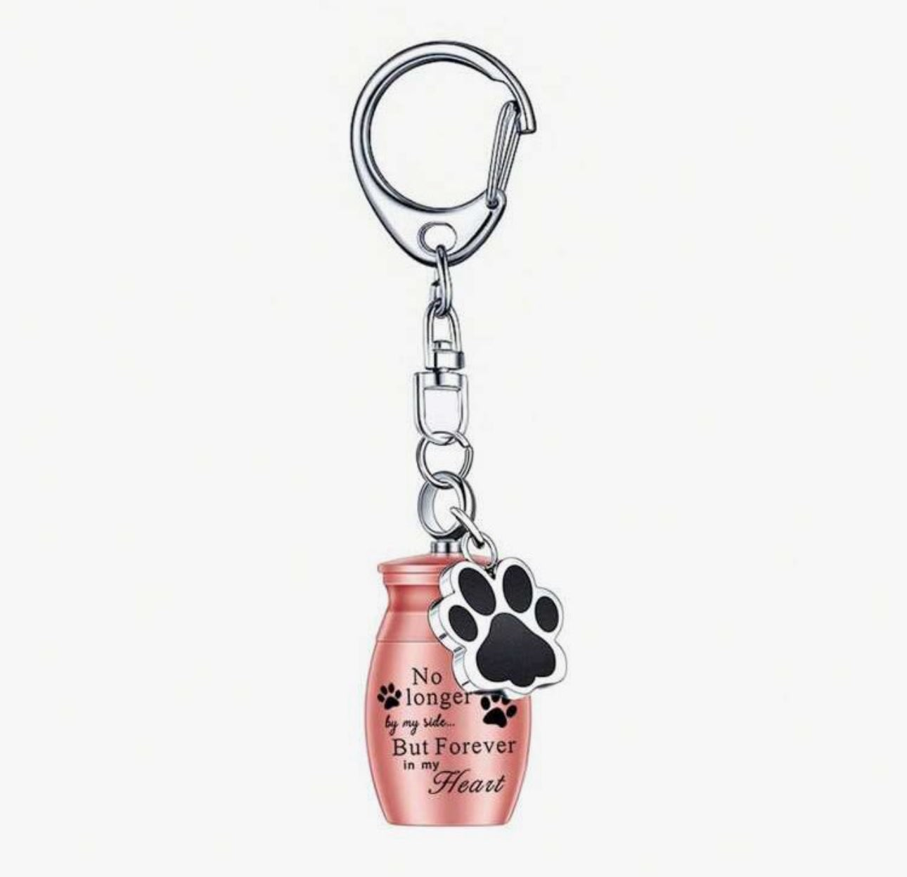 A stainless steel keyring featuring a mini urn charm with an engraved quote and a paw print charm attached to a black keychain.