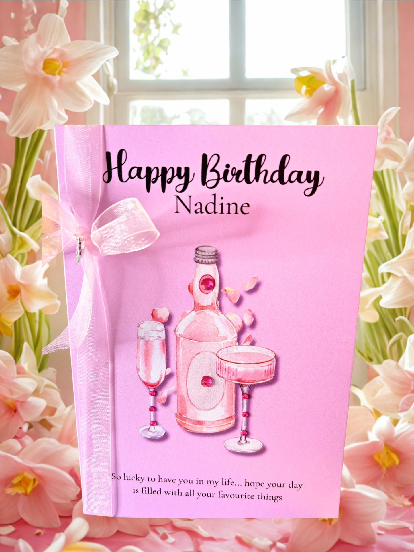 Pink personalised birthday card with celebration drinks. With ribbon and rhinestones