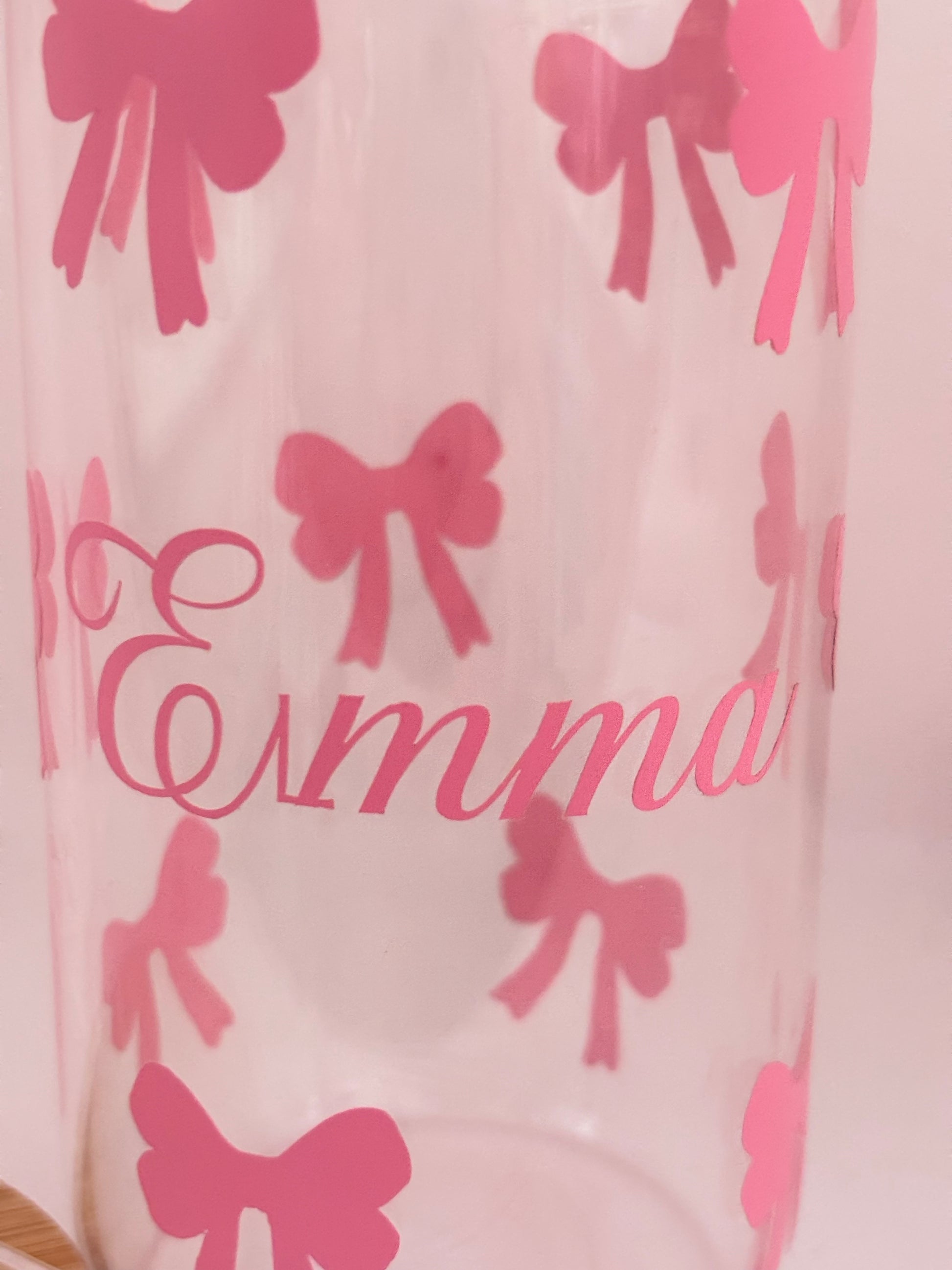 Glass with Pink bows and the name 'Emma' on a light pink background