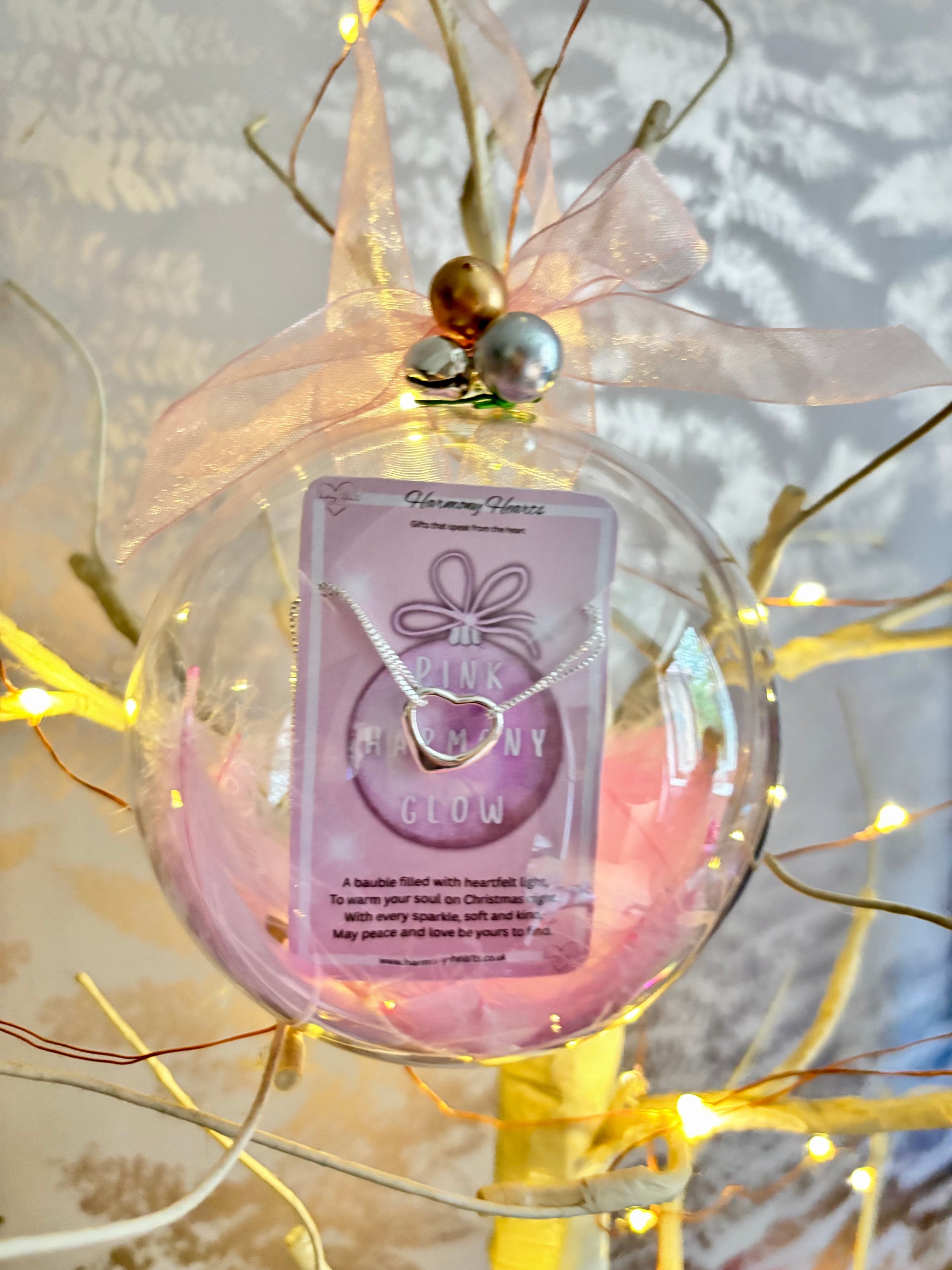 Clear christmas bauble with a bracelet inside
