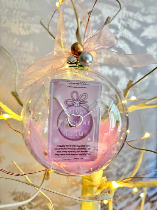Clear christmas bauble with a bracelet inside