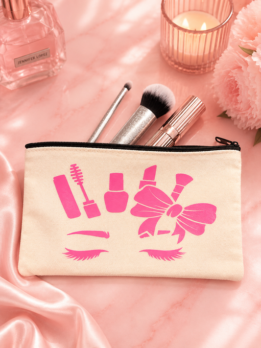 Makeup pouch with pink makeup icons on a pink fabric background with makeup items.