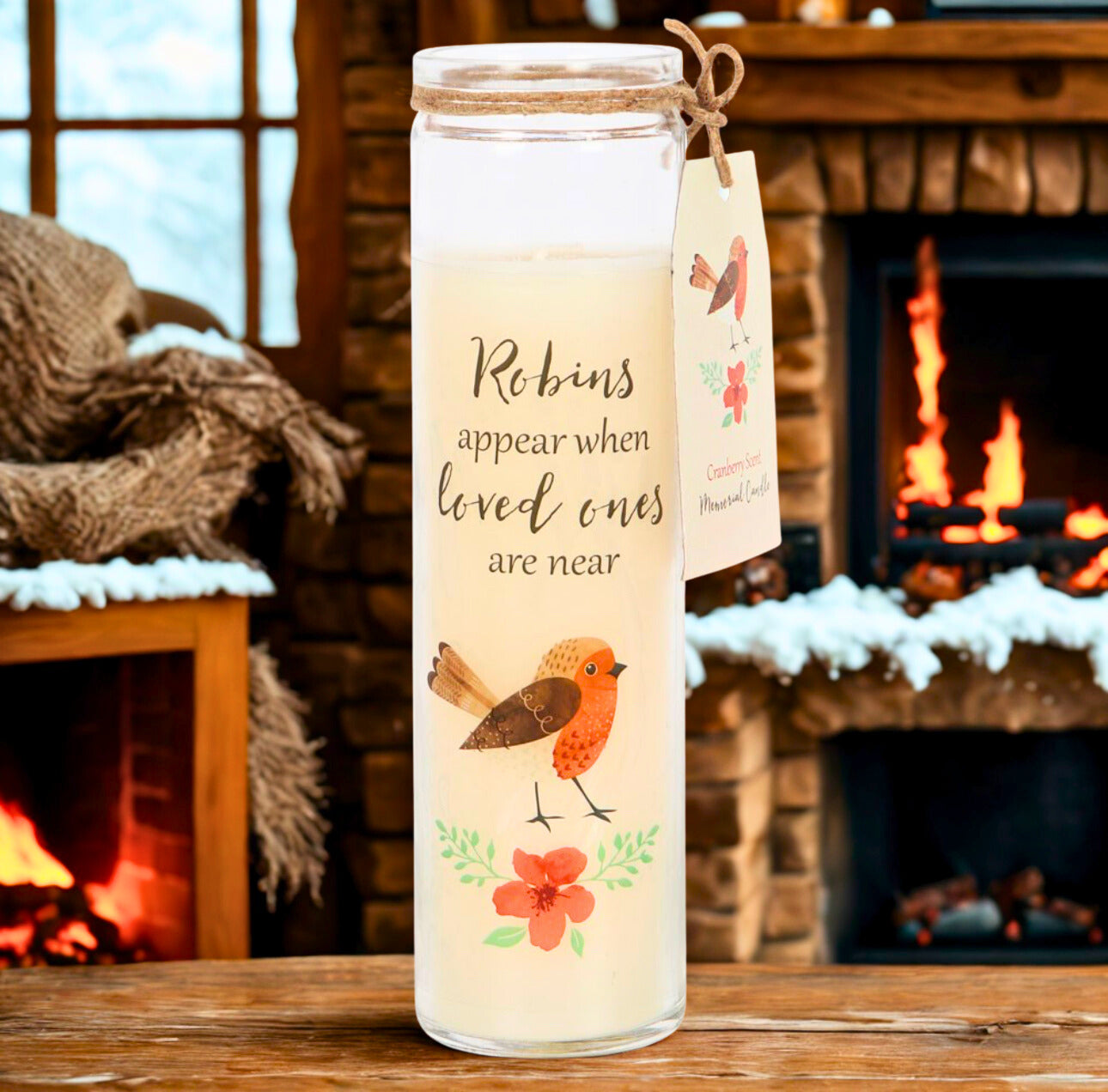 Tall glass candle jar with a robins appear illustration with a fireplace background