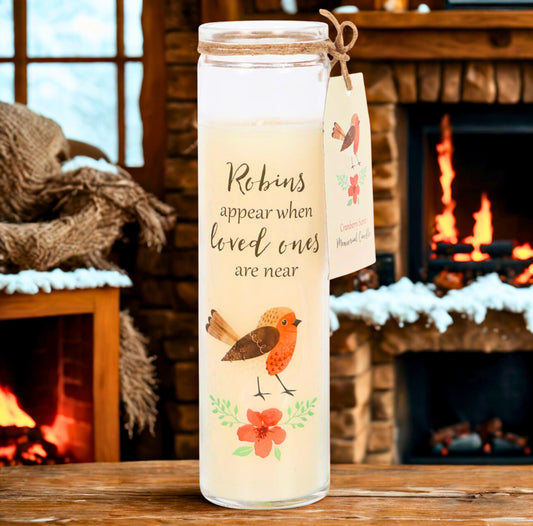 Tall glass candle jar with a robins appear illustration with a fireplace background