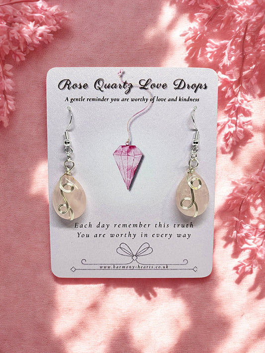 Rose quartz Earrings on a card with pink floral background