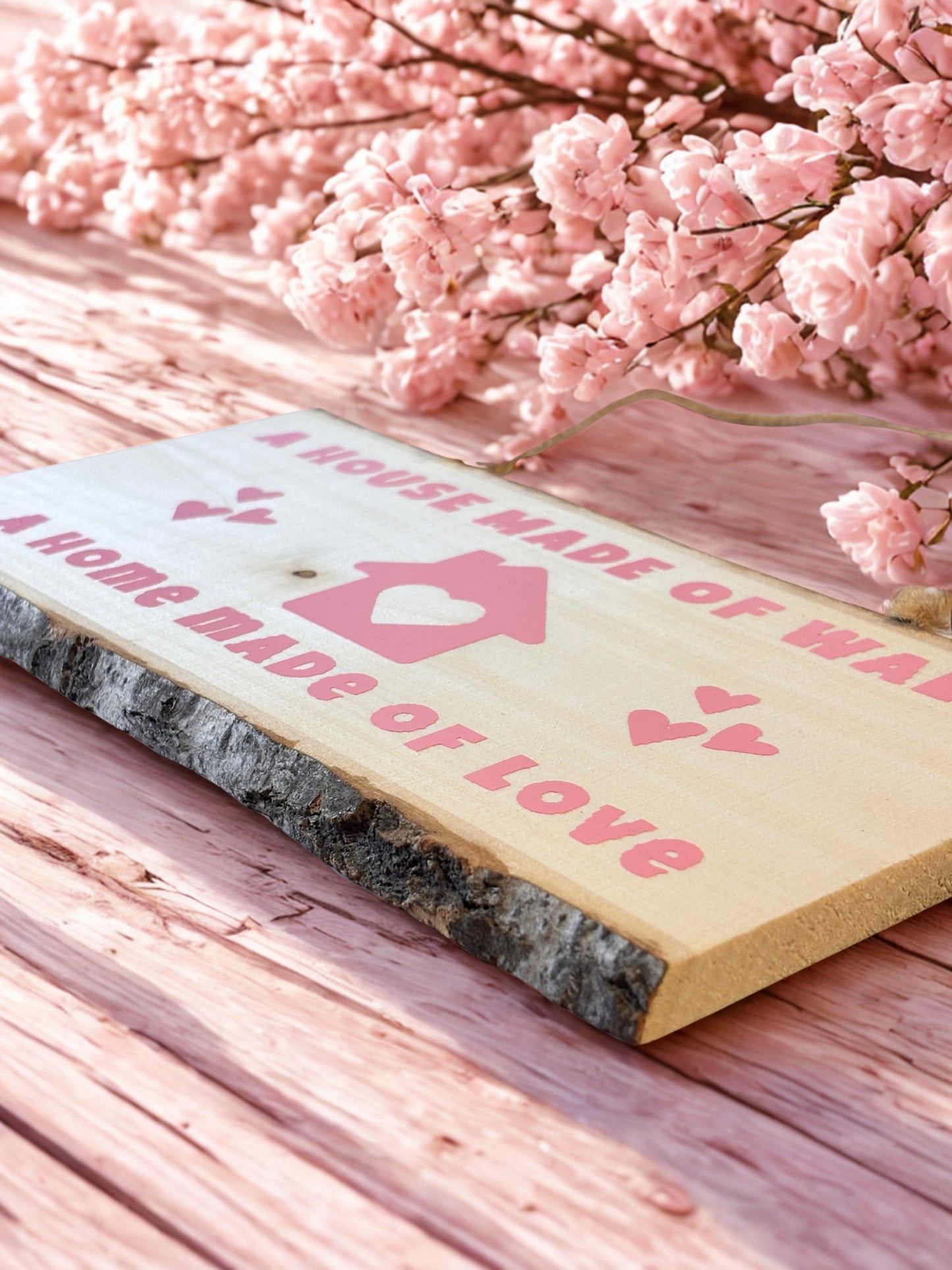 Rustic decorative sign with the message A house made of walls - a home made of love