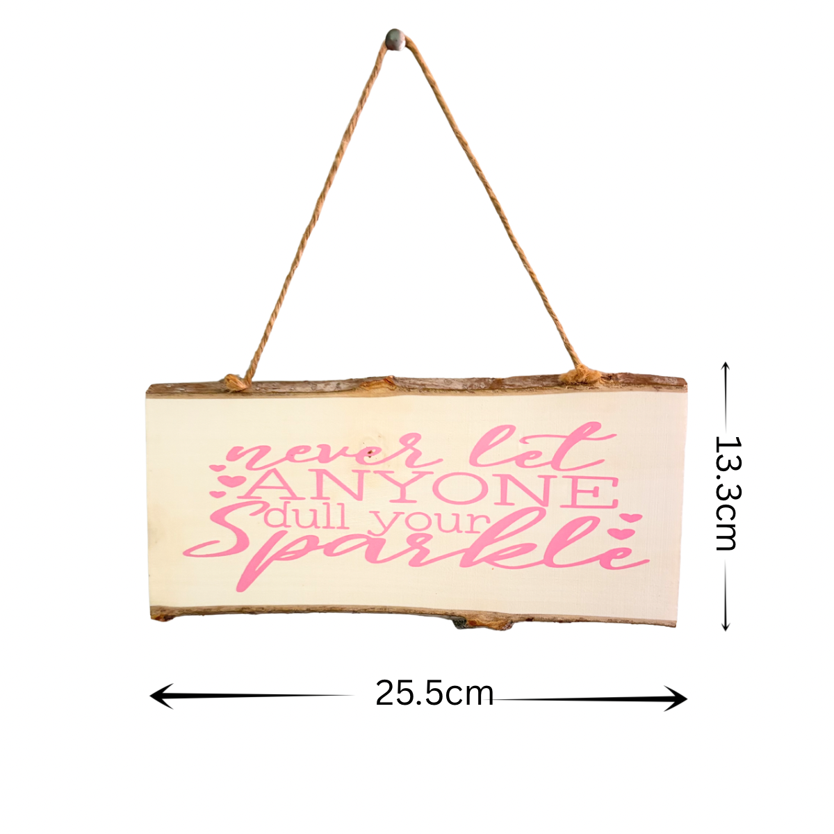 Wooden sign with motivational quote 'never let anyone dull your sparkle' and measurements on a white background